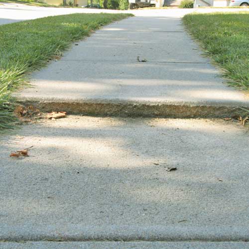 Sinking uneven concrete sidewalk in Minneapolis, MN