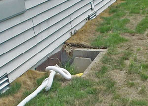 old concrete window well of a Rochester crawl space