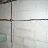 Severe foundation damage from a long crack in a bucking wall of a Lakeville home.
