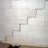 A diagonal stair step crack along the foundation wall of a Minot, ND home