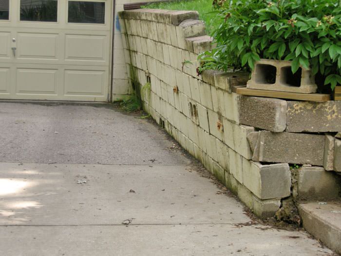 a failing retaining wall around a driveway in Fargo