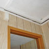 The ceiling and wall separating as the wall sinks with the slab floor in a Minot, ND home