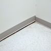 A partition wall separating from the floor in a Newport home.