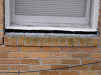 A window sill cracking and separating from the foundation wall in a Breckenridge home.