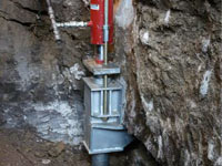 Foundation repair contractors lifting a structure in Minneapolis.