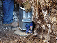Securing a foundation footing bracket for a foundation repair system in Cottage Grove.