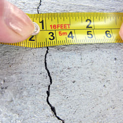 A crack in a poured concrete wall that's showing a normal crack during curing in Winona