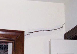 A large drywall crack in an interior wall in St. Cloud