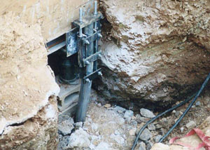 a bent, failed foundation push pier installed in Rochester.
