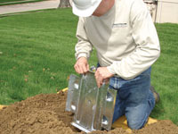 Fastening an earth anchor for a severely bowing wall in Eau Claire.