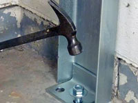 Mounting a foundation channel anchor installation to the floor in Maple Grove.