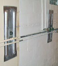 A foundation wall anchor system used to repair a basement wall in Mankato