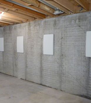 Wall anchor covers covering a foundation wall repair system in Grand Forks, Cottage Grove, La Crosse, Lakeville, Inver Grove Heights