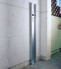 A failing foundation wall repaired with a foundation wall channel anchor system in a Bismarck home.