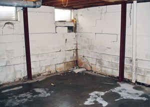 A failed, rusty i-beam foundation wall system installed in Mason City.