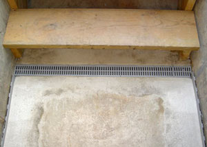 Our grated drain system installed on a leaking basement staircase in Mason City.