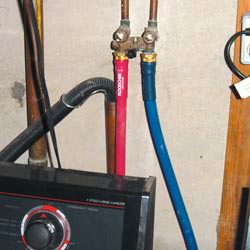 Washer hoses in a basement  in Alexandria