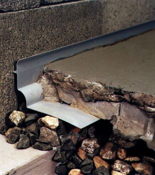 a custom designed basement drain system for thin basement floors in Shakopee.