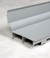 A closeup of our FlowGuard drain system for wet basements in West Fargo.