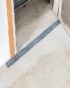 A potentially wet basement protected by our grated basement drainage system