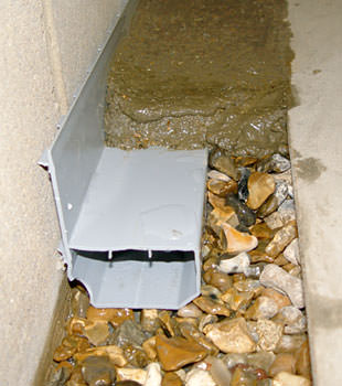 A basement drain system installed in a Maple Grove home