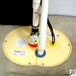 A sump pump system installed along a basement floor in Fargo.