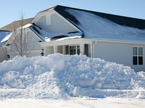 Huge snow pile outside of home