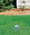 A buried gutter drain downspout extension installed in a Winona home