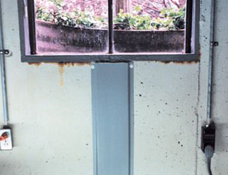 Repaired waterproofed basement window leak in Bismarck