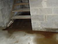 Water Pouring into a Grand Forks Basement through Hatchway Doors